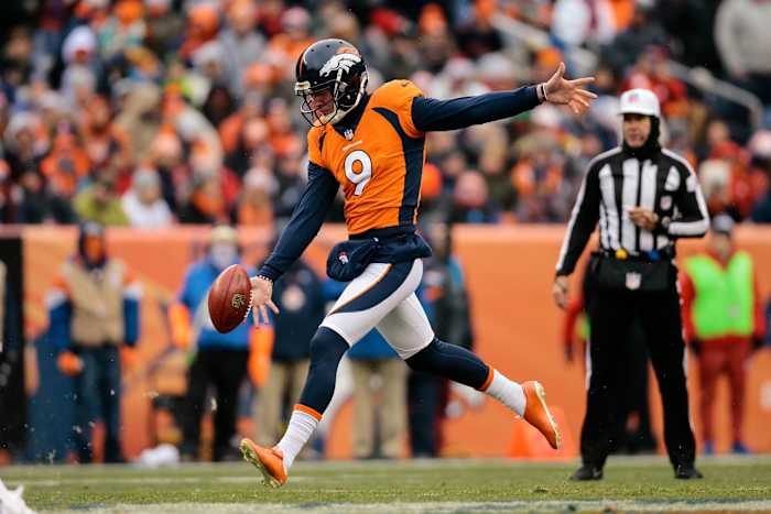 Denver Broncos punter Riley Dixon (9) punts the ball in the first quarter against the Kansas City Chiefs at Sports Authority Field at Mile High.